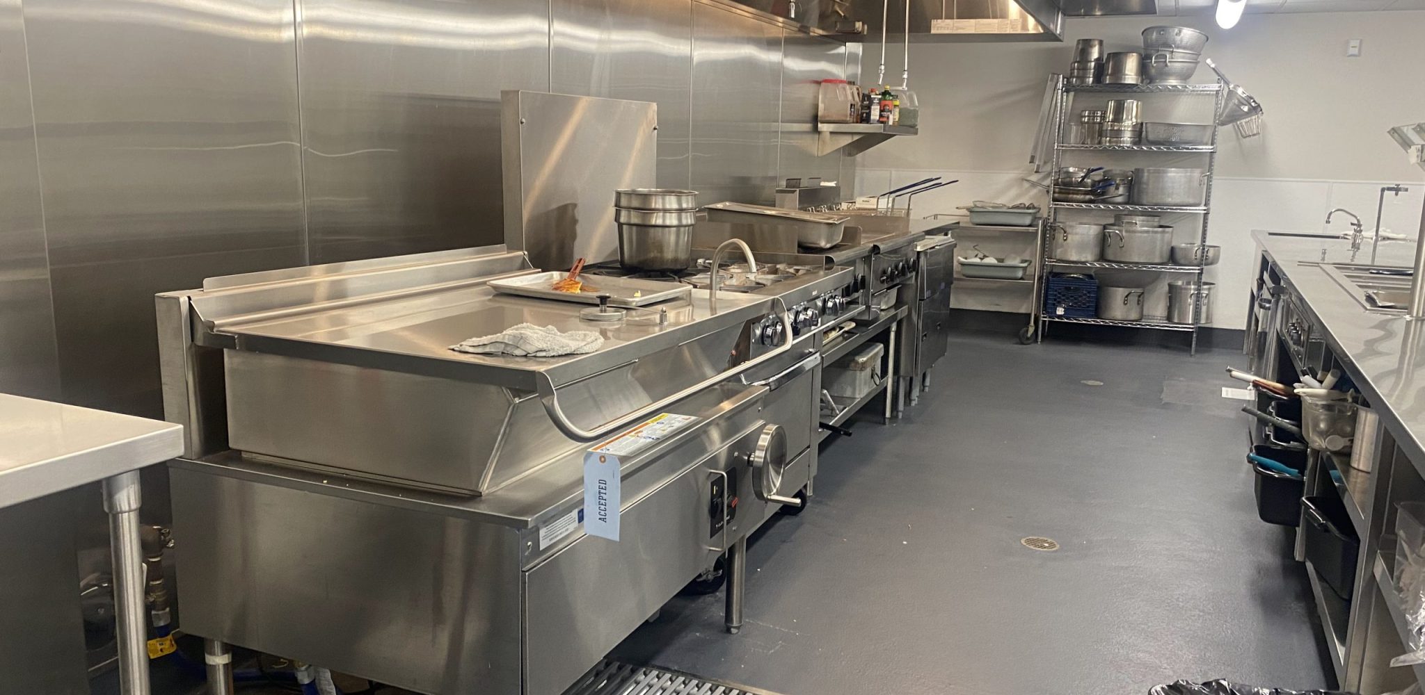 Grease trap inside a commercial kitchen sink