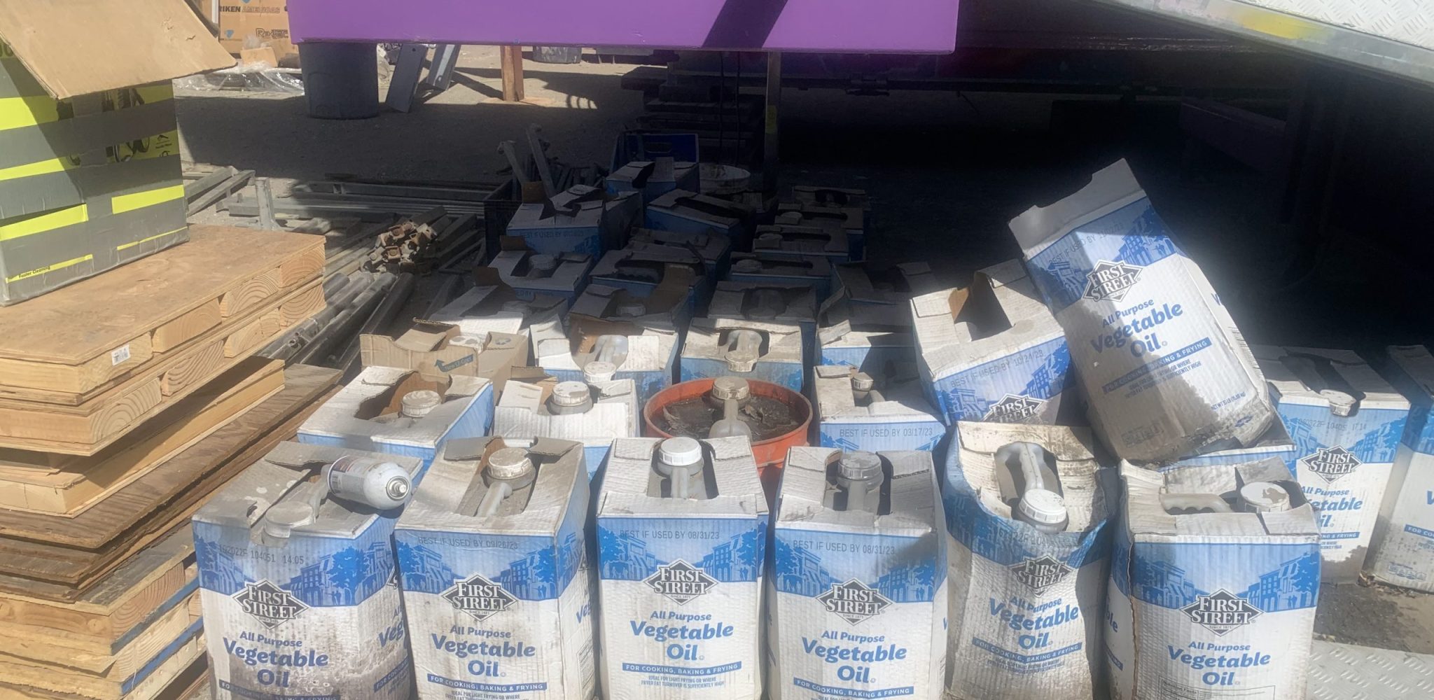 Used cooking oil containers ready for eco-friendly recycling pickup